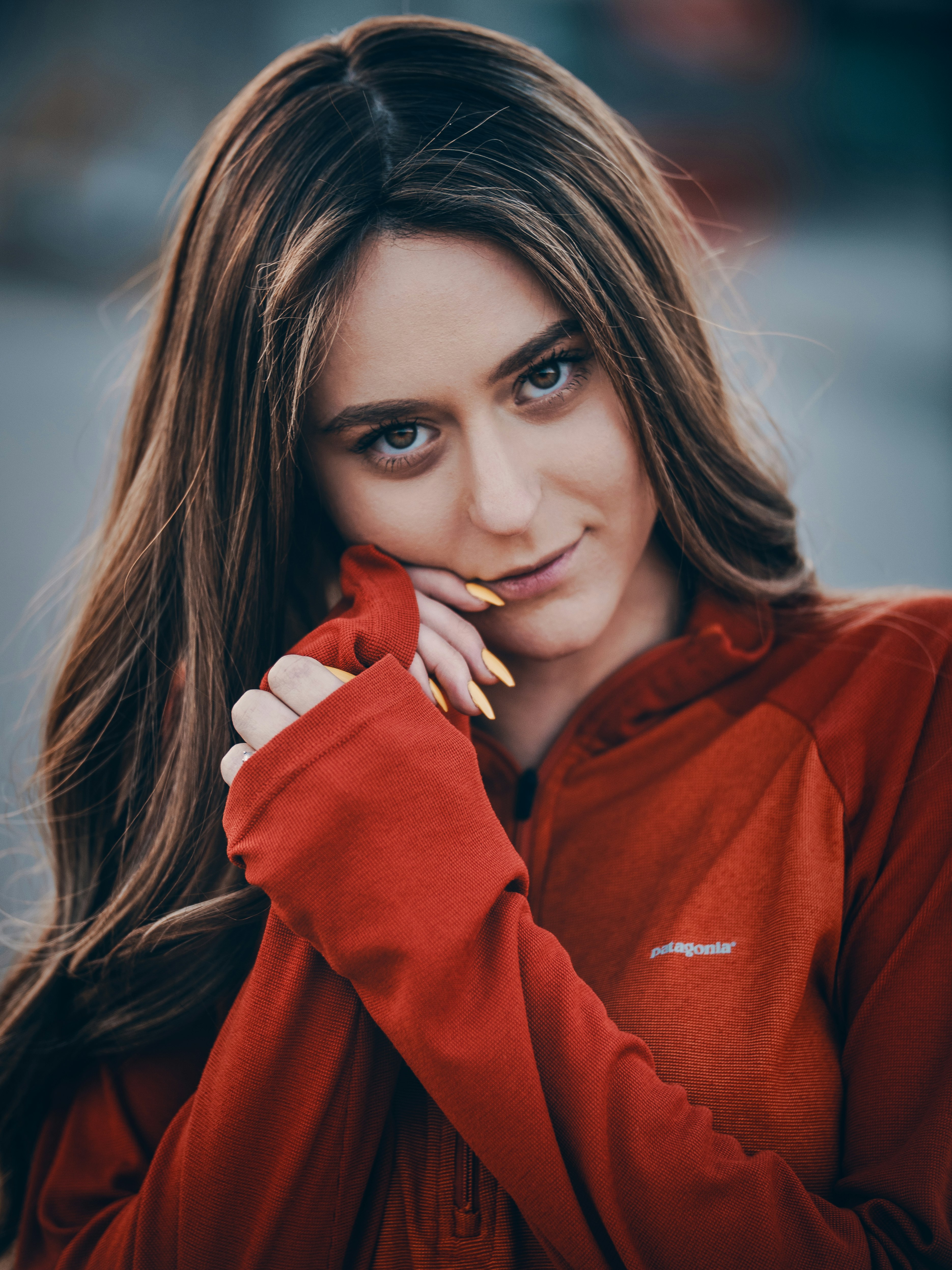 smiling woman wearing red jacket